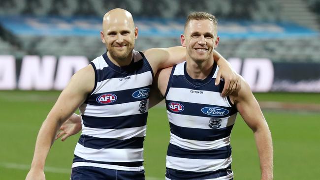 Gary Ablett and Joel Selwood of the Cats walk off after their milestone games. Pic: Michael Klein