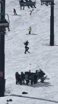 Dramatic moment snowboarder falls off chairlift