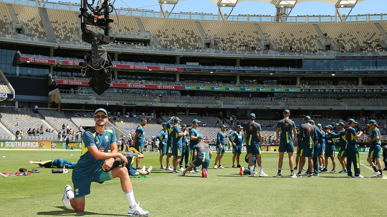 PERTH, AUSTRALIA – NOVEMBER 04: Mitchell Starc of Australia interacts with TV commentators via the "Flying Fox" camera while warming up before game one of the One Day International series between Australia and South Africa at Optus Stadium on November 04, 2018 in Perth, Australia. (Photo by Paul Kane – CA/Cricket Australia/Getty Images)