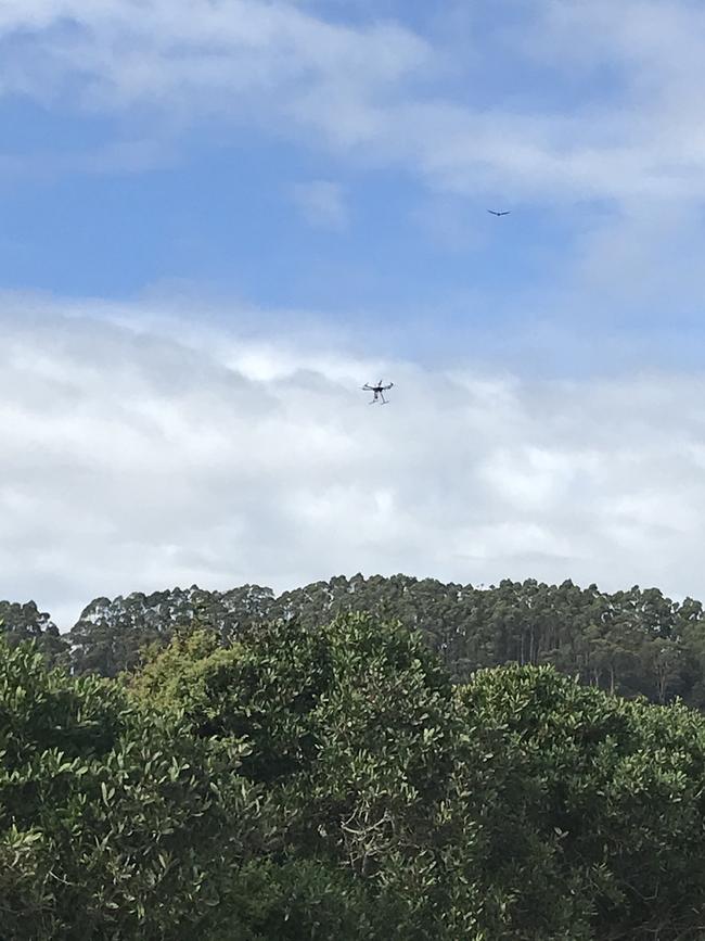 Drones are being used in the hunt for two men at South Burnie Beach after multiple police evade incidents early this morning.