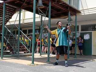 FINAL TASK: Burnett State College had 39 Year 12 graduates ring the school bell before they walked out the gates as students for the last time. Picture: Felicity Ripper