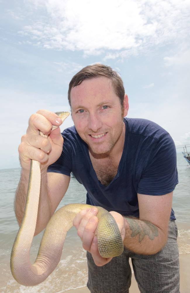 Darwin Snake Catchers director Luke Allen holds a highly venomous beaked sea snake. Picture: Supplied