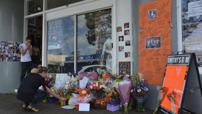 Mourners place flowers in front of Smithy's Gym in honour of boxer Braydon Smith. Picture: Stuart Cumming