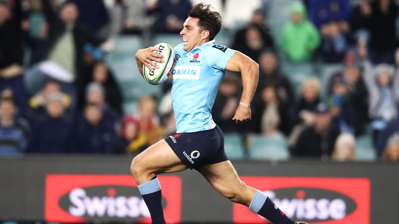 Nick Phipps of the Waratahs breaks away to score a try at Allianz Stadium.