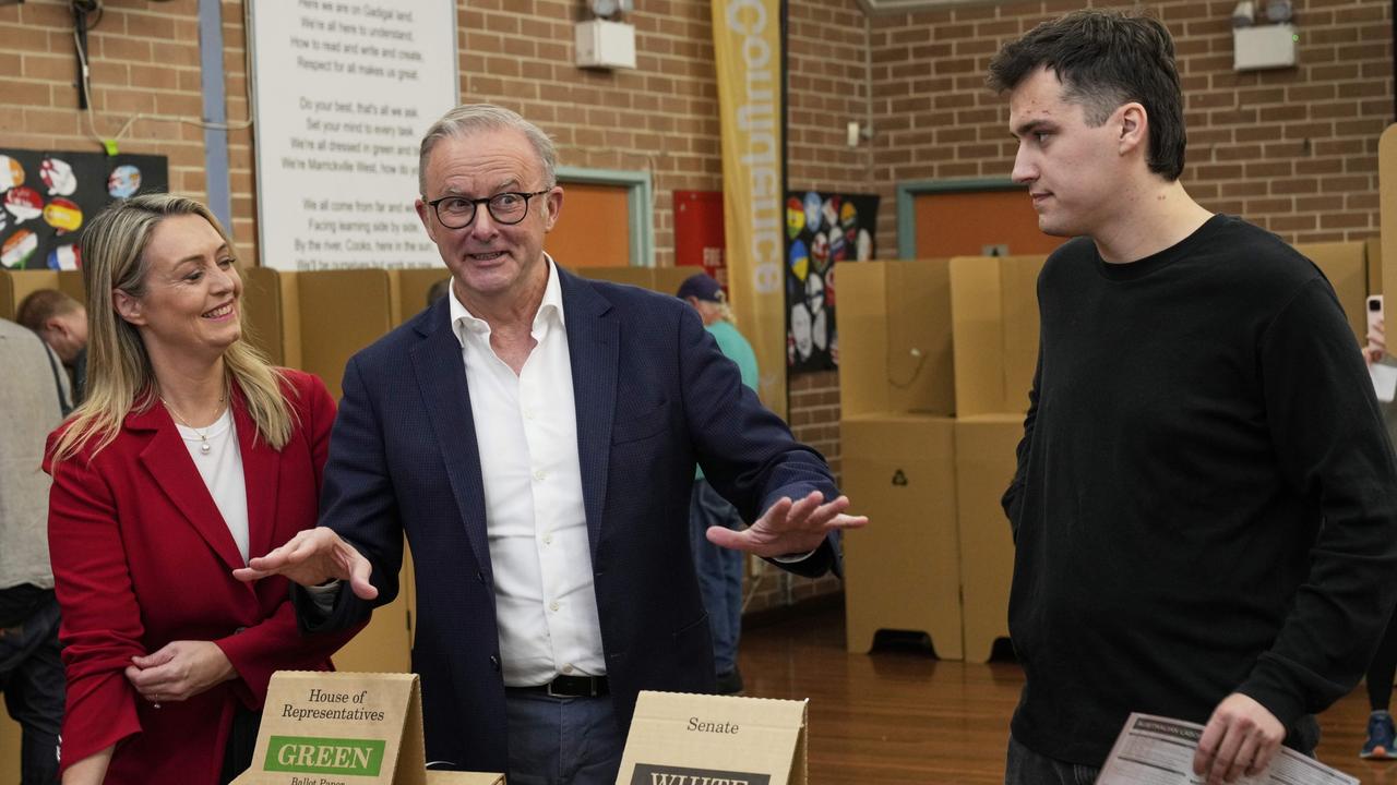 Anthony Albanese, centre, and his son Nathan react after voting as Albanese's partner Jodie Haydon watches at a polling booth in his electorate in Sydney, Saturday, May 3, 2025. Picture: AP Photo/Rick Rycroft