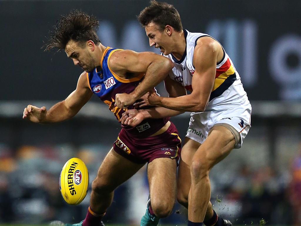 Rhys Mathieson of the Lions collides with Tom Doedee of the Crows during the Round 18 AFL match between the Brisbane Lions and the Adelaide Crows at the Gabba in Brisbane, Saturday, July 21, 2018. (AAP Image/Jono Searle) NO ARCHIVING, EDITORIAL USE ONLY