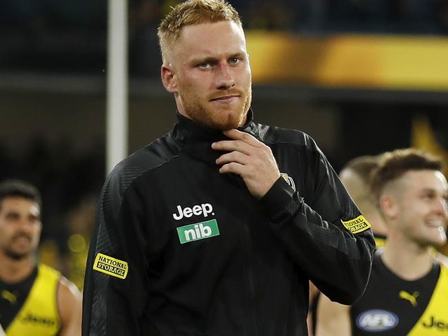 MELBOURNE, AUSTRALIA - MARCH 18: Nick Vlastuin of the Tigers leaves the field with a leg injury after a win during the 2021 AFL Round 01 match between the Richmond Tigers and the Carlton Blues at the Melbourne Cricket Ground on March 18, 2021 in Melbourne, Australia. (Photo by Dylan Burns/AFL Photos via Getty Images)