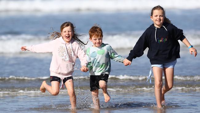 Georgia, Mac and Maggie at Ocean Grove main beach. Picture: Glenn Ferguson