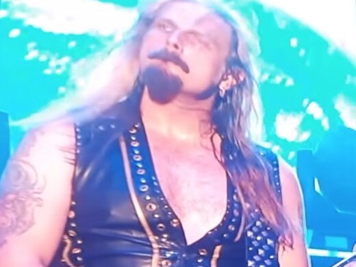 Richie Faulkner performs on stage.