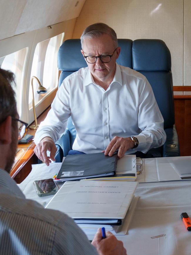 Albanese on board an RAAF aircraft flight from Sydney to Brisbane.