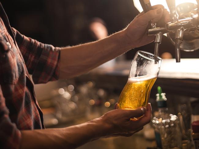 Bartender pureeing beer from a tap