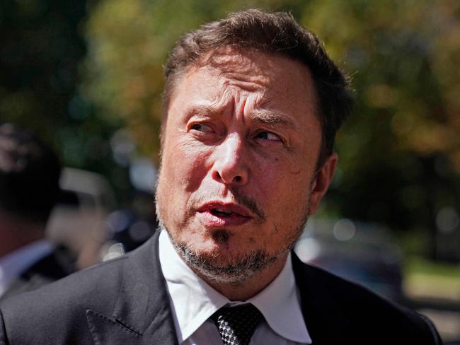 (FILES) Elon Musk, CEO of Tesla and X, speaks to reporters as he leaves the âAI Insight Forumâ at the Russell Senate Office Building on Capitol Hill in Washington, DC, on September 13, 2023. US market regulators on October 5, 2023, asked a judge to order Elon Musk to comply with a subpoena to answer questions about his purchases of Twitter shares last year. Musk, who beefed up his stake in Twitter before buying the company for $44 billion, did not show up for a scheduled deposition in September with the Securities and Exchange Commission (SEC), according to a legal filing. (Photo by Nathan Howard / GETTY IMAGES NORTH AMERICA / AFP)