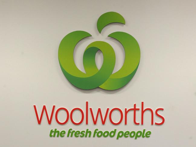 **FILE** A Tuesday, April 19, 2011 file photo of a logo outside a Woolworths grocery store in Brisbane. Woolworths says its first half sales rose five per cent to $29.7 billion despite the supermarket giant facing subdued consumer confidence and falling prices on Tuesday, Jan. 31, 2012. (AAP Image/Dave Hunt) NO ARCHIVING