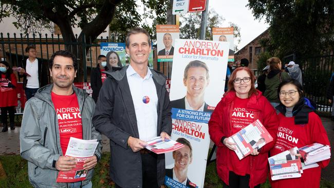 Labor candidate Andrew Charlton surrounded by volunteers at the Granville polling station.