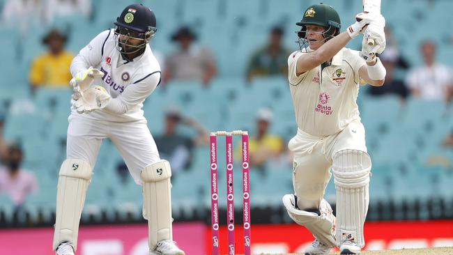 Australia's Steve Smith drives during his brisk innings during the final session at the Sydney Cricket Ground Picture: Phil Hillyard