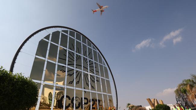 An aeroplane flies over the Sharm el-Sheikh International Convention Centre. Picture: AFP