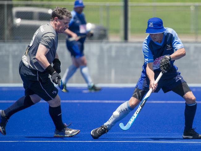 Action in the Pan Pacific Masters Games Hockey tournament. Picture: Glenn Campbell