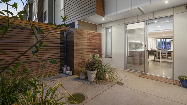 The private rear courtyard is directly off the kitchen.