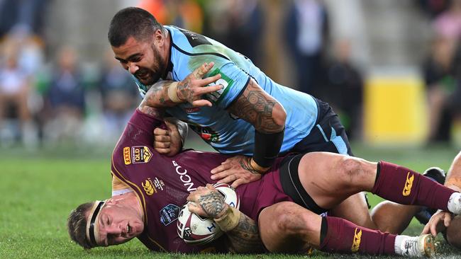 Andrew Fifita finishes all over Josh McGuire. Picture: AAP I