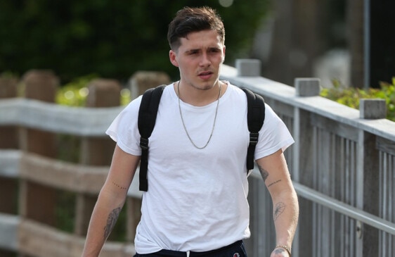 Brooklyn Beckham keeps things casual in a black T-shirt and shorts as he  picks up a smoothie