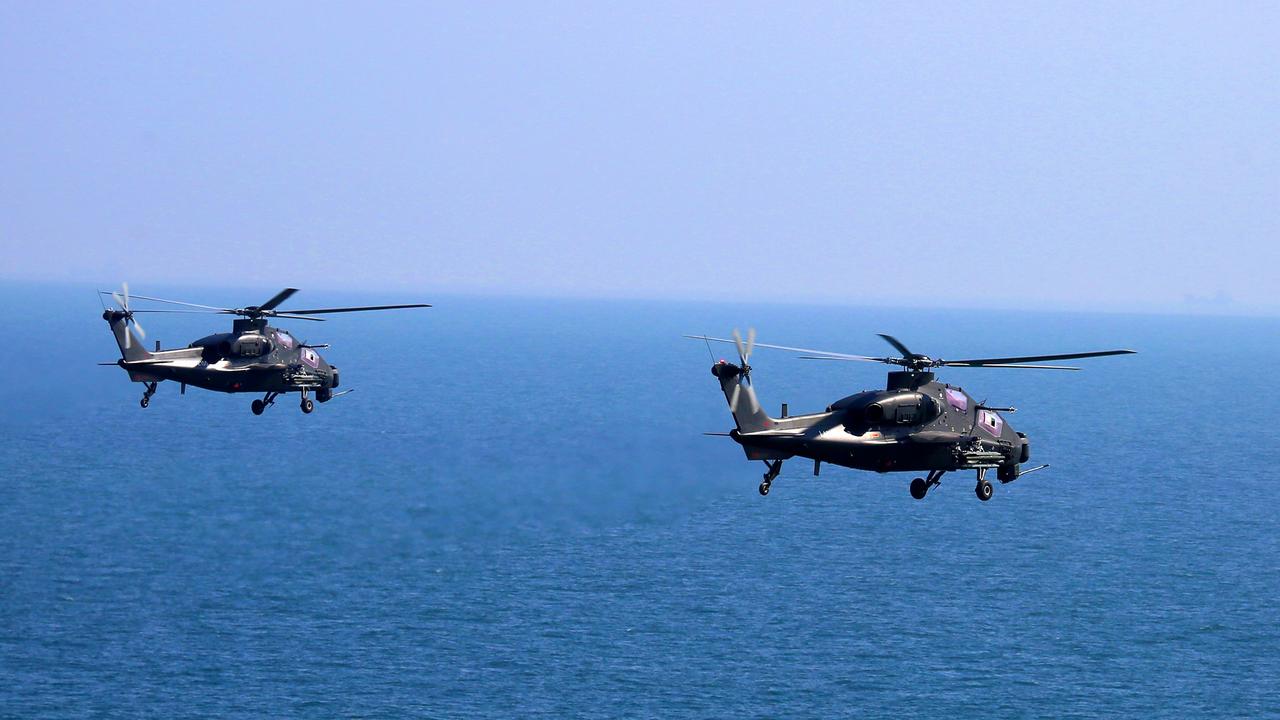 Two attack helicopters attached to an army aviation brigade under the PLA Eastern Theater Command during a flight training exercise on June 9, 2021. (eng.chinamil.com.cn/Photo by Zhang Huanpeng)