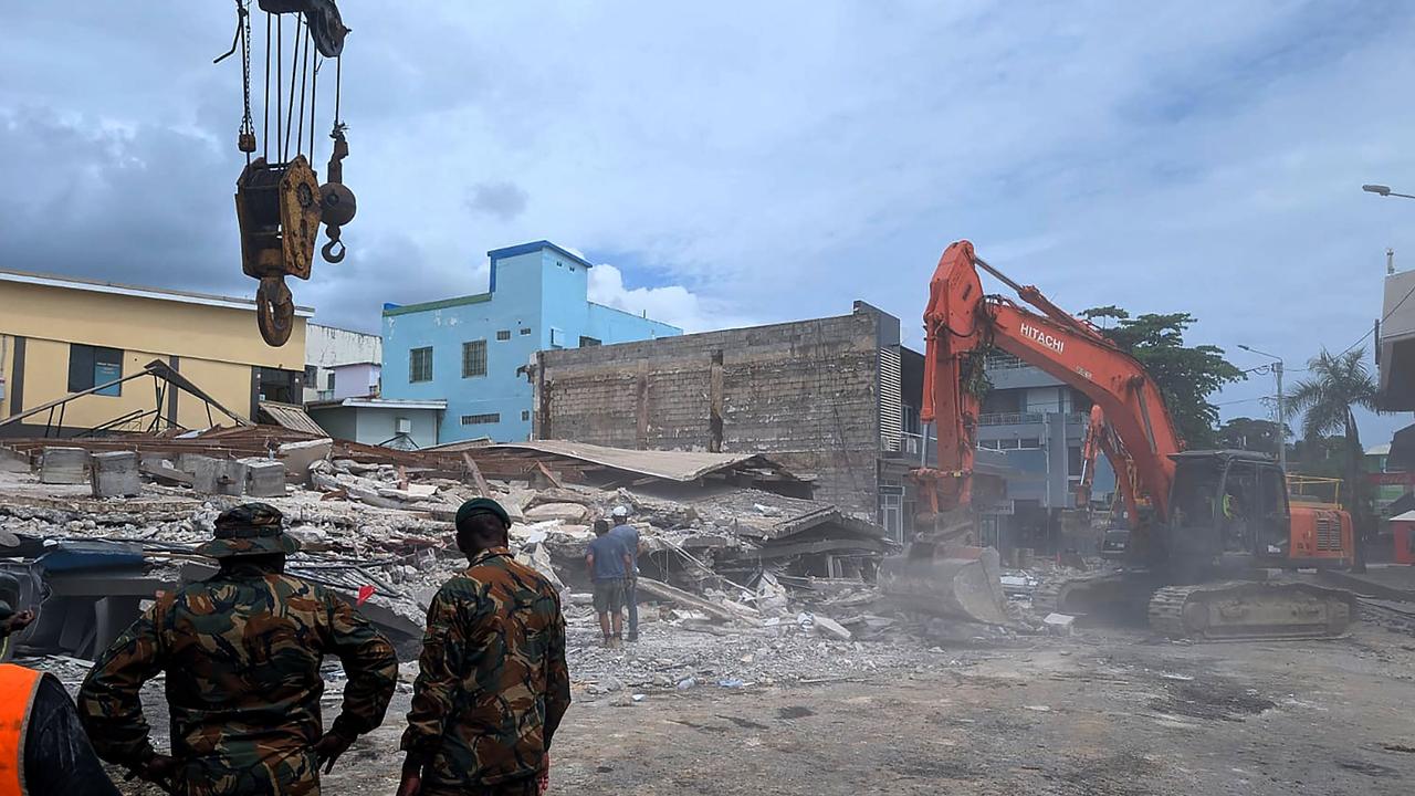 Rescue workers are seen at the site of a collapsed building after an earthquake struck Port Vila, the capital city of Vanuatu, on December 18, 2024. Picture: AFP