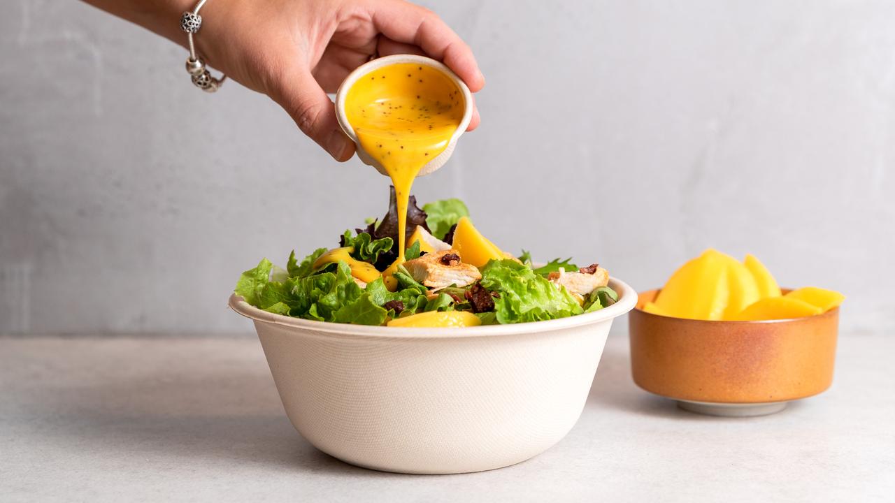 The pair travelled to every weekend farmers’ market along the east coast to sell their family’s award-winning, chef-created dressings. Picture: Supplied