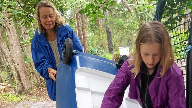 COMPOST: Sunshine Beach Primary School environmental leader Amelie adding to compost bins after the school's recent International Food Fair. Picture: Contributed