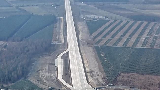 The lack of a median strip and large parking bay to the side are a sign this German autobahn could be used to land fighter jets.