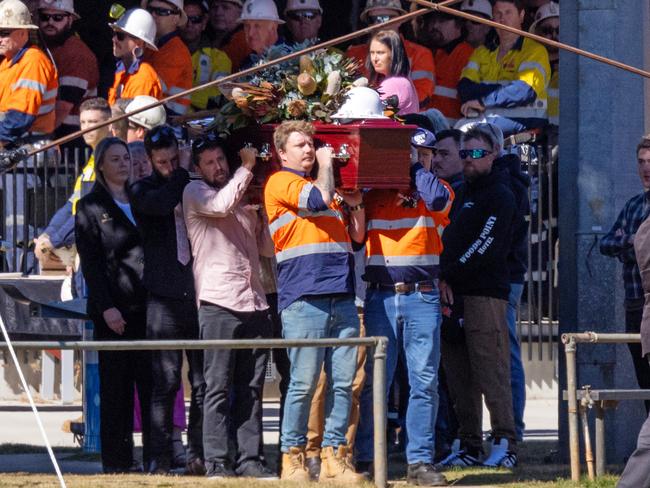 Kurt Hourigan’s casket is carried from the funeral service. Picture: Mark Stewart