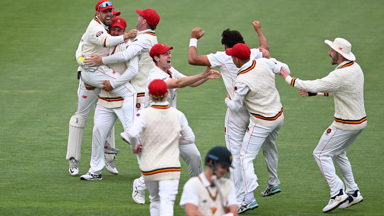 South Australia players celebrate the two run vicotry over Tasmania at Bellerive Oval. (Photo by Steve Bell/Getty Images)