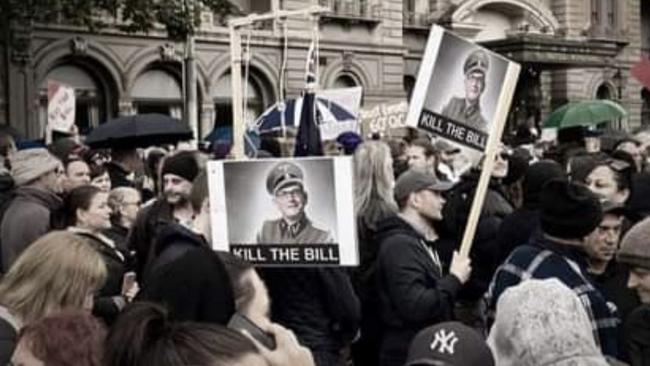 Placards of Daniel Andrews dressed as Adolf Hitler were paraded around during Saturday’s protests.