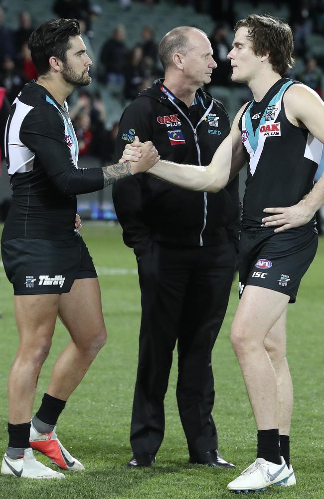 Port Adeladie’s Chad Wingard with Jared Polec and coach Ken Hinkley after the Power’s round 23 loss. Picture Sarah Reed