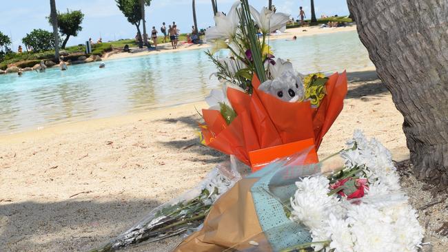 Tributes were left at Airlie Beach Lagoon after a 30-year-old Chinese man and his five-year-old son drowned in 2018.