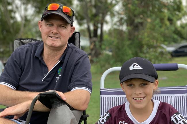 Alan Pershouse and Bodie Pershouse, 11, of Slade Point take in the Slade Point Slashers v Moranbah Bulls in Mackay Rugby Union Round 4 Seniors A-Grade Anzac Day clash at Cathy Freeman Oval in Slade Point. Saturday, April 23, 2022. Picture: Tara Miko