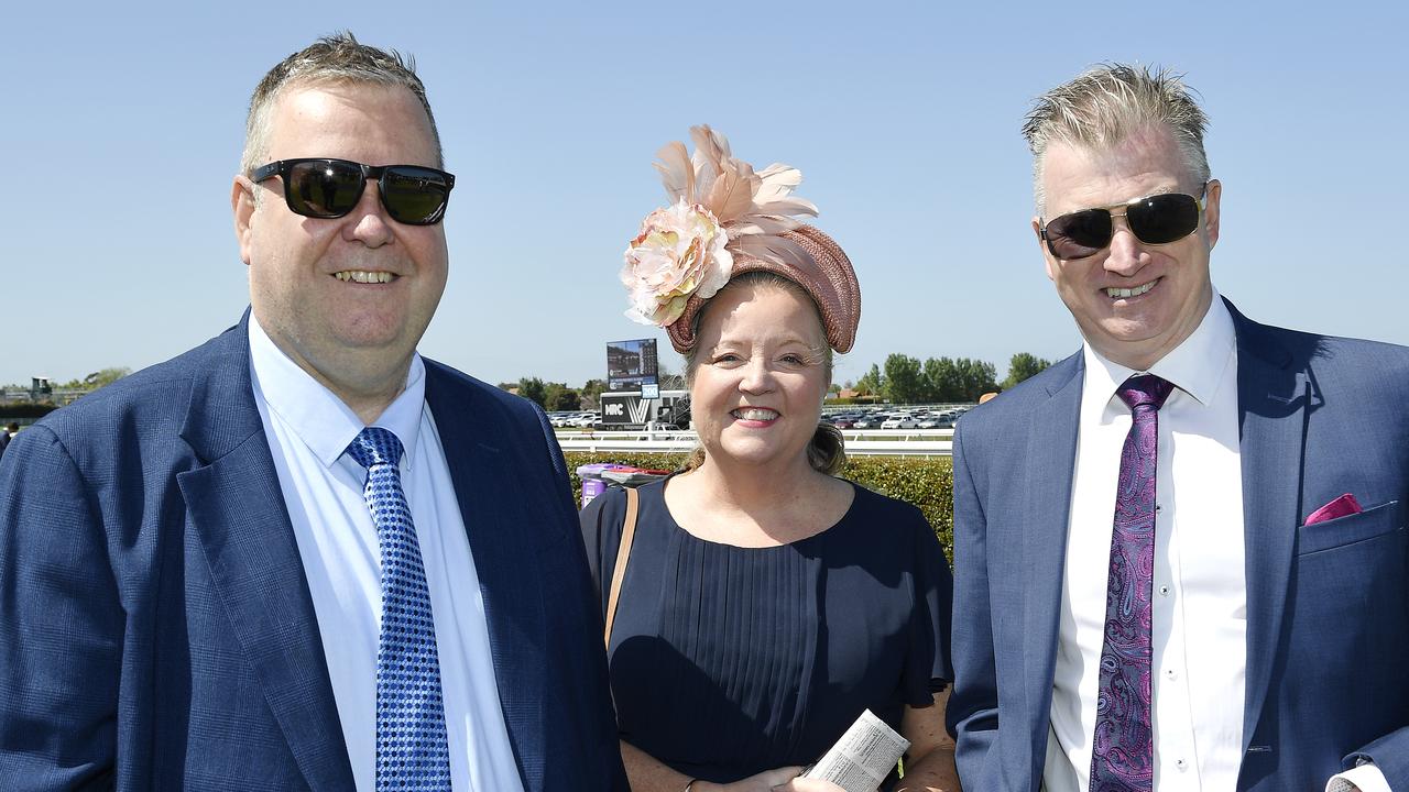 Caulfield Guineas horse race meeting, Caulfield, Victoria, Saturday 12th October 2024. Faces in the crowd. Pictured enjoying the race meeting are Tony, Tracy and Andrew. Picture: Andrew Batsch