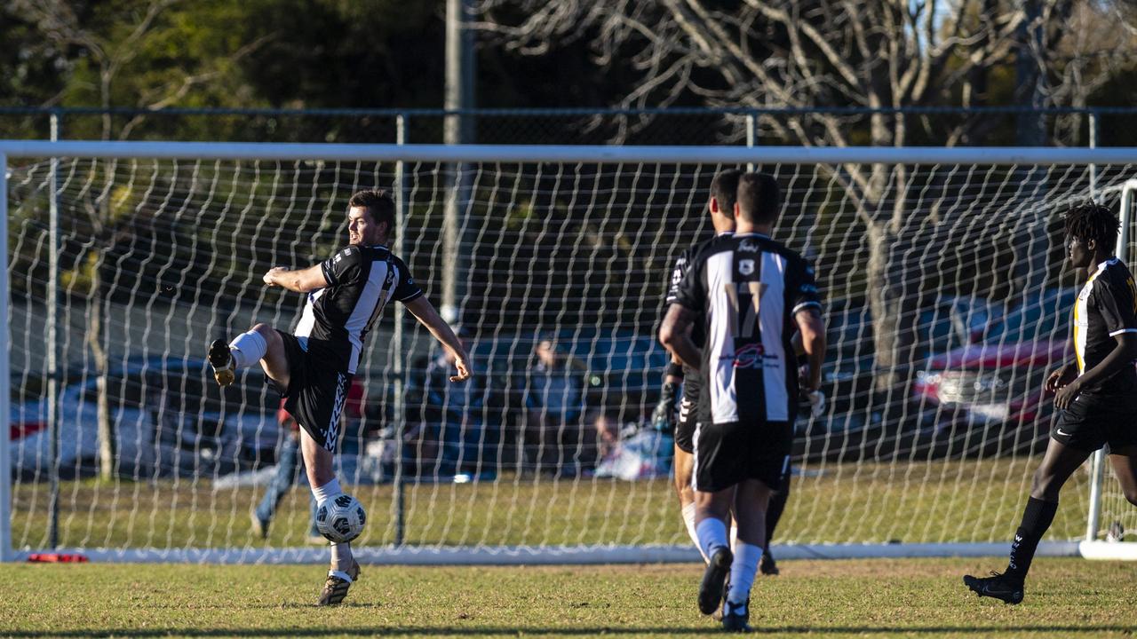 Alastair McGorm of Willowburn defends against West Wanderers in FQPL Men Darling Downs Presidents Cup football at West Wanderers, Sunday, July 24, 2022. Picture: Kevin Farmer