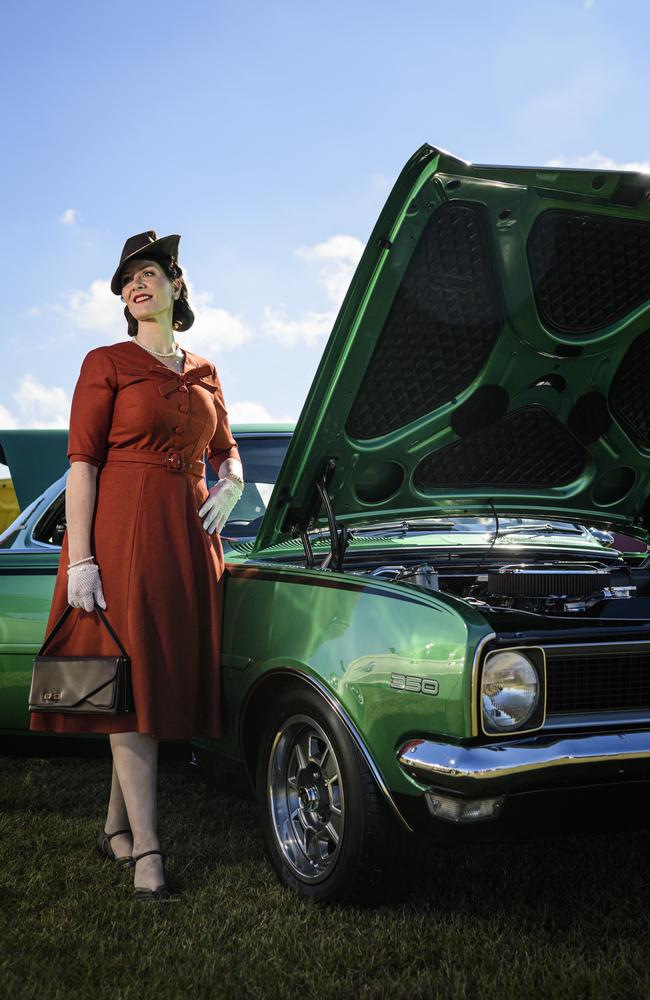 Regina St Johnwood with a 1970 Holden Monaro HG owned by her dad on show at the David Hack Classic. Regina went on to win the fashion parade, Sunday, May 18, 2025. Picture: Kevin Farmer
