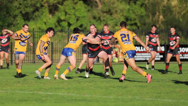 Campbell Rubie taking a hit up for Collegians. Picture: Steve Montgomery