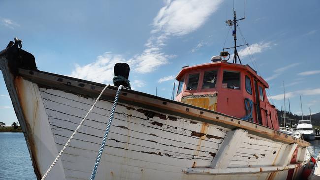 Craig Bellgrove with wooden boat Goondooloo that has been salvaged from the Tamar River to be restored in Hobart.  Picture: Nikki Davis-Jones