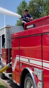 Firefighters use fire engine to help kids cool off