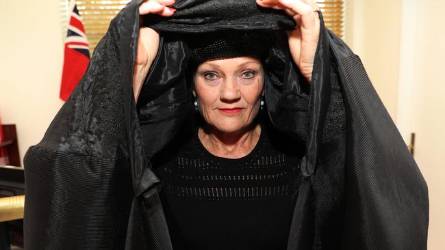 One Nations Leader Senator Pauline Hanson in a burqa in her office. Picture: Gary Ramage