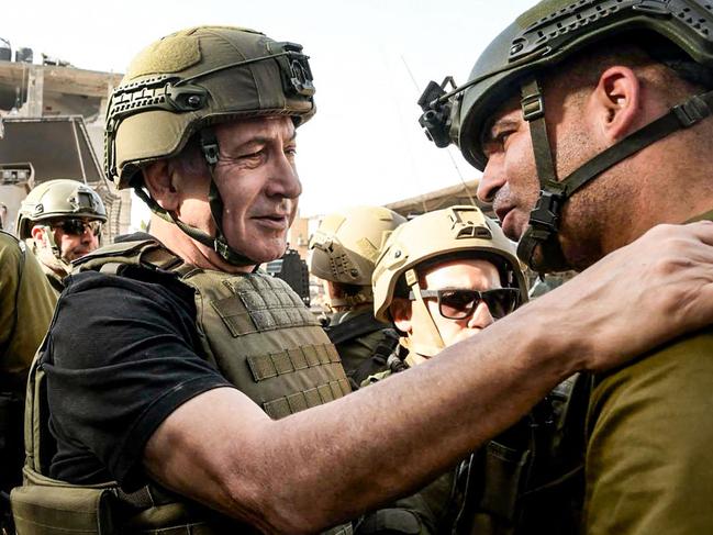 Israeli Prime Minister Benjamin Netanyahu meets soldiers in the Gaza Strip. Picture: Handout / Israeli Prime Minister Office / AFP