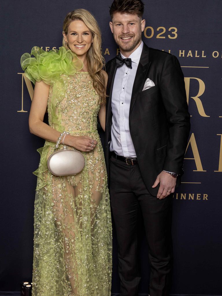 Lauren Gibbs, wearing couture+love+madness, with her husband Bryce Gibbs on the Magarey Medal red carpet at Adelaide Oval. Picture: Kelly Barnes