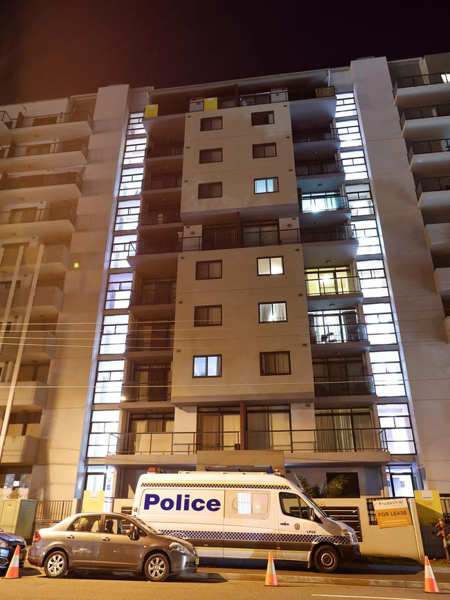 Police lock down the Campbell St apartment building in Liverpool.