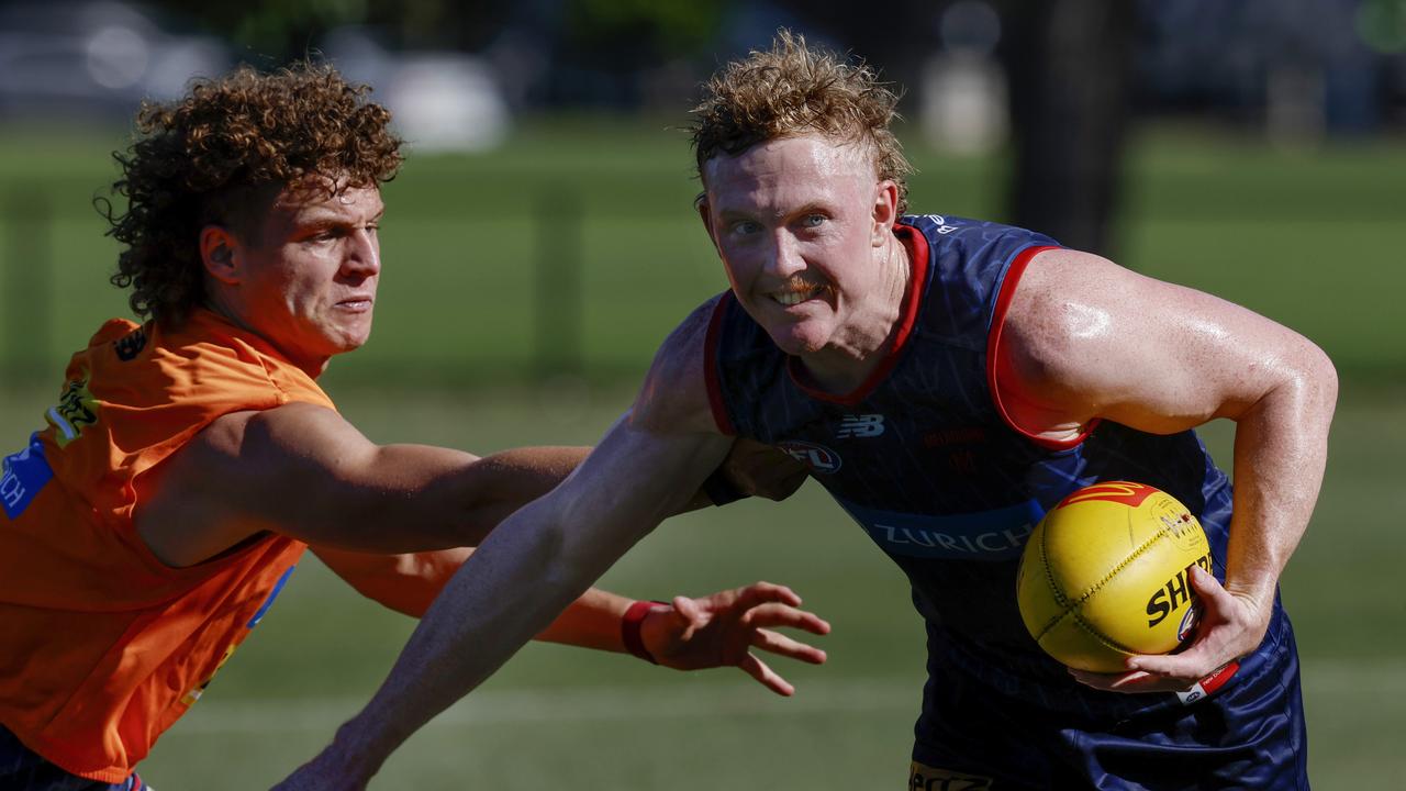 Clayton Oliver of the Demons fends off Koltyn Tholstrup during pre-season training. Picture: Michael Klein