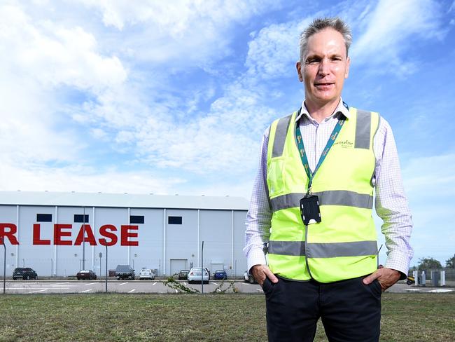 Kevin Gill, Townsville Airport CEO outside vacant aeroplane hangers up for lease