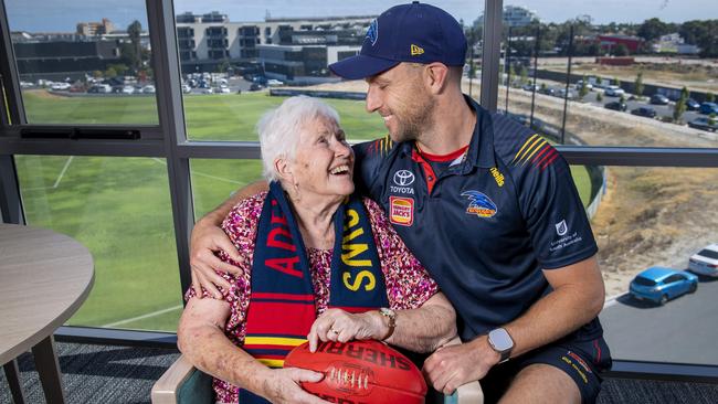 Brodie Smith who plays his 250th game for the Crows with his biggest fan his Grandmother Josie Franklin, 85, who lives in the SA Uniting nursing home that looks over the Crows training ground where she watches her grandson train. Picture: Mark Brake