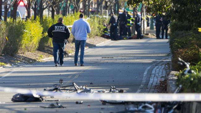 Bicycles and debris lay on a bike path near West and Houston Streets after people were injured after during incident on a bike path in New York Tuesday, Oct. 31, 2017. (AP Photo/Craig Ruttle)