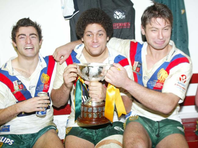 NOVEMBER 22, 2003: Kangaroos' Willie Mason (C) and Luke Ricketson (R) not too impressed by the beer and champagne mixture in the Ashes trophy as Anthony Minichiello enjoys the show at the end of the Third Test, Great Britain v Australia at McAlpine Stadium, Huddersfield, England, 22/11/03. Pic Colin Whelan, Action Photographics.Rugby League p112///NOVEMBER 22, 2003: Kangaroos' Willie Mason (C) and Luke Ricketson (R) not too impressed by the beer and champagne mixture in the Ashes trophy as Anthony Minichiello enjoys the show at the end of the Third Test, Great Britain v Australia at McAlpine Stadium, Huddersfield, England, 22/11/03. Pic Colin Whelan, Action Photographics.Rugby League